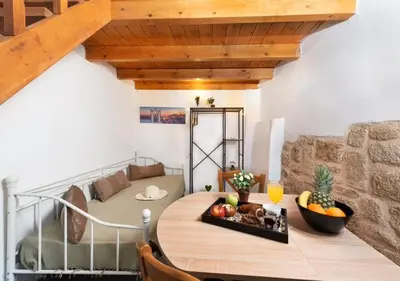a living room with a table and a couch at Emerald Dream House#Poiessa, Medieval Town in Rhodes Town