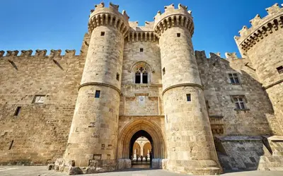 a large stone building with an arch entrance at Emerald Dream House#Poiessa, Medieval Town in Rhodes Town