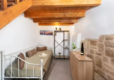 a living room with a bed and a wooden ceiling at Emerald Dream House#Poiessa, Medieval Town in Rhodes Town