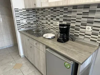 a kitchen with a sink and a blender on a counter at Apollonio Rooms Faliraki Rhodes in Faliraki