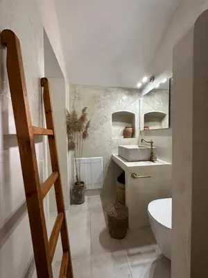 a bathroom with a sink and a toilet in it at Constantia in Symi