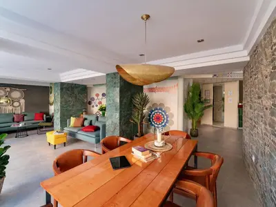 a dining room with a wooden table and chairs at STAY Rhodes Hotel in Rhodes Town