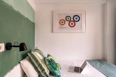 a bedroom with a bed and a picture on the wall at STAY Rhodes Hotel in Rhodes Town