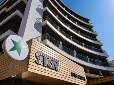 a sign on the side of a building with a star at STAY Rhodes Hotel in Rhodes Town