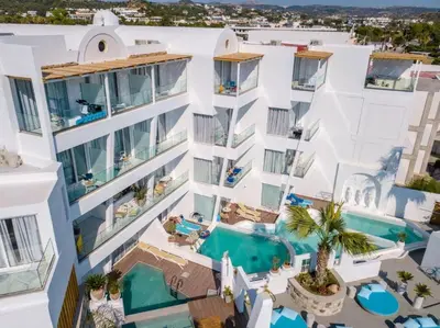 an aerial view of a building with a swimming pool at Kouros Home & Suites in Faliraki