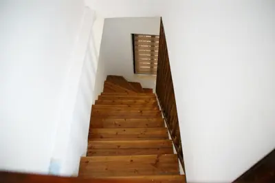 a staircase in a house with wooden floors at Evangelia's Little House in Rhodes Town