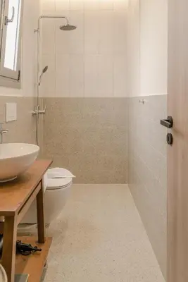 a bathroom with a toilet and a sink at Oliveto A Flumine - Experientia Villa in Pastida