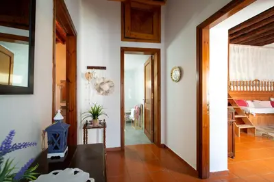 a hallway of a home with white walls and a doorway at My sweet Greek dream - Traditional home in Soroni