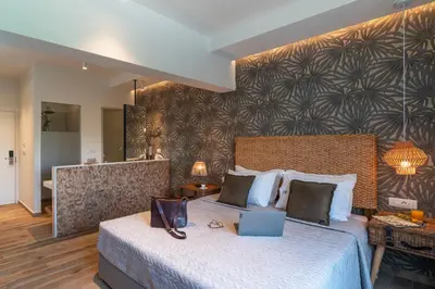 a hotel room with a bed with a laptop on it at Naillac Boutique Hotel in Rhodes Town
