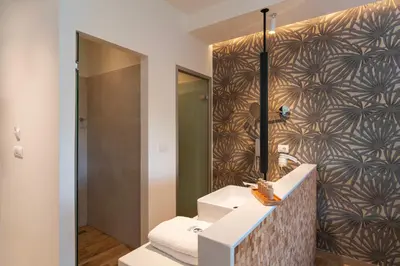 a bathroom with a sink and a mirror at Naillac Boutique Hotel in Rhodes Town
