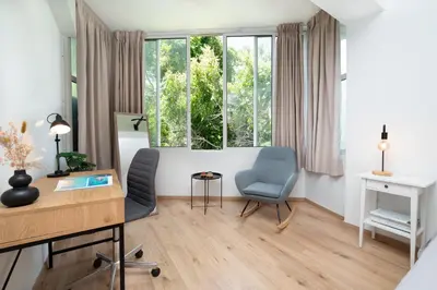 a living room with a desk and a chair at Gravity Downtown Scandi Studio in Rhodes Town
