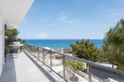 a balcony with a view of the ocean at ANASTASIOS HOUSE STEGNA - UP FLOOR in Archangelos