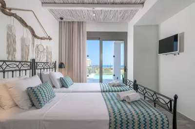 a bedroom with a large bed and a television at Villa Krini Delight in vlicha