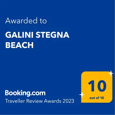 a yellow sign with the text awarded to gilini steampunk beach at GALINI STEGNA BEACH in Archangelos