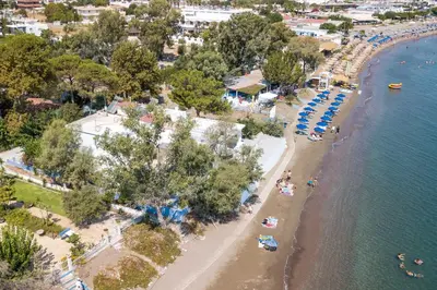 an aerial view of a beach with umbrellas at Salty Beach Front House Faliraki in Faliraki