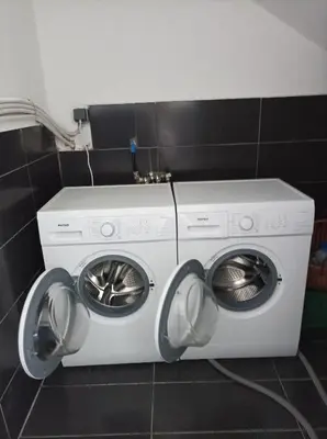 a washing machine and a dryer in a bathroom at Home Away From Home in Ixia