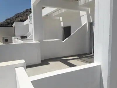 a white building with a view of a mountain at Pefki Irish Seaview in Pefki Rhodes