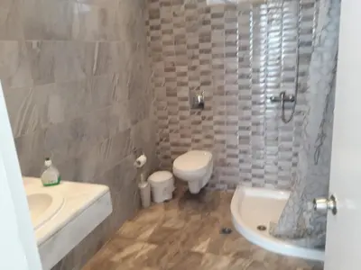 a bathroom with a sink and a toilet and a shower at Pefki Irish Seaview in Pefki Rhodes
