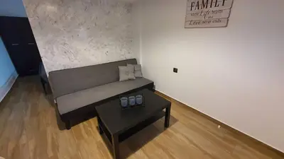 a living room with a couch and a table at FANES HOUSE in Phanaes