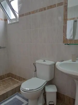 a bathroom with a toilet and a sink at Marilen in Livadia