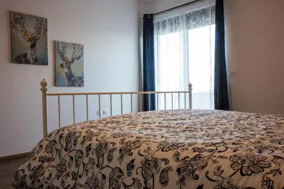 a bedroom with a bed and a window with a bedspread at Roccia di Isidoro in Áyios Isídhoros