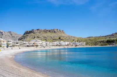 a view of a beach with a mountain in the background at Haraki Bay Loft (by haris) in Haraki