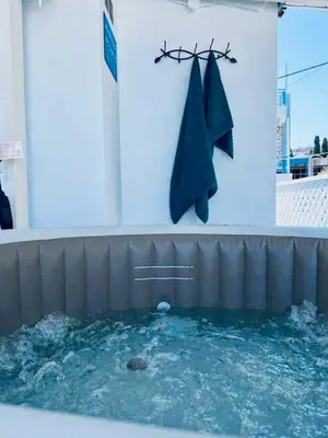 a pool of water with a towel hanging on a wall at Thalassia Avra Stegna Beach in Archangelos