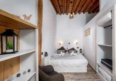 a bedroom with a white bed in a room at Lotza Traditional House Salakos in Sálakos