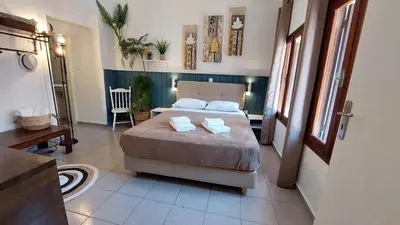 a bedroom with a bed with two towels on it at OLD TOWN TALES apartments in Rhodes Town