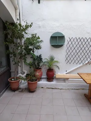 a group of potted plants sitting next to a wall at OLD TOWN TALES apartments in Rhodes Town