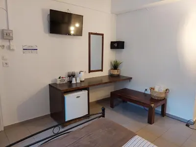 a room with a desk and a mirror and a table at OLD TOWN TALES apartments in Rhodes Town