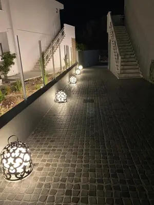 a row of lights on a sidewalk at night at RHODIAN TREASURE Spiridione apartment in Rhodes Town