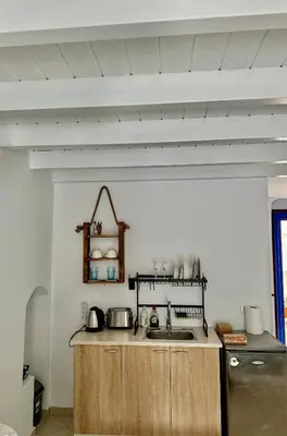 a kitchen with a sink and a counter top at Cavo apartment in Symi