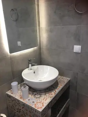 a bathroom with a sink and a mirror at RHODIAN TREASURE Spiridione studio 1 in Faliraki