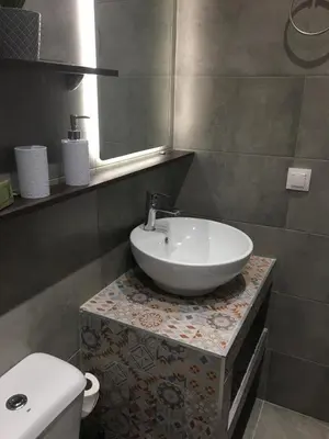 a bathroom with a sink and a toilet at RHODIAN TREASURE Spiridione studio 1 in Faliraki