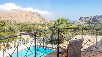 a balcony with a view of a mountain at Villa Selene in Archangelos