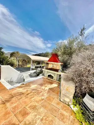 a patio with a fireplace and a gazebo at 50 Shades of Blue in vlicha