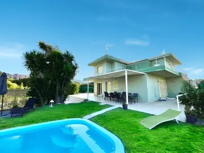 a house with a swimming pool in the yard at Masefa villa in Ialyssos