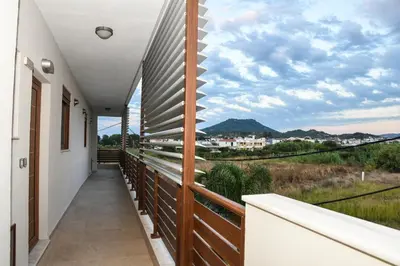 a balcony with a view of the mountains at Seaside Luxury Apartments Kremasti in Kremasti