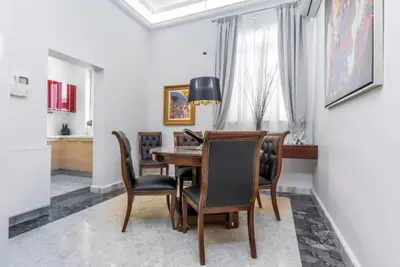 a dining room with a table and chairs at Arhondiko Apartment VS Rhodes Town in Rhodes Town