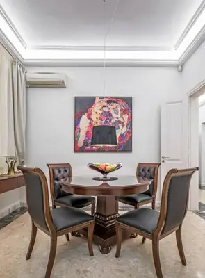 a dining room with a table and chairs at Arhondiko Apartment VS Rhodes Town in Rhodes Town