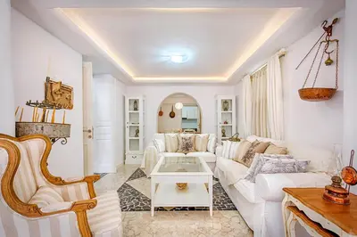 a living room with a white couch and a table at Luxury Living Nisos Vs Rhodes town in Rhodes Town