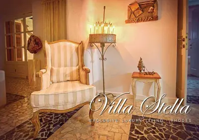 a room with a chair and a side table at Luxury Living Nisos Vs Rhodes town in Rhodes Town