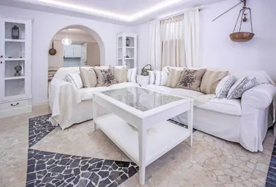 a white living room with a white couch and a table at Luxury Living Nisos Vs Rhodes town in Rhodes Town