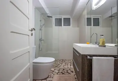 a bathroom with a toilet and a shower and a sink at Luxury Living Nisos Vs Rhodes town in Rhodes Town