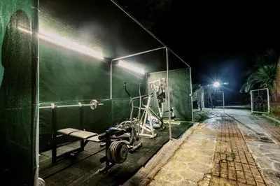 a gym with a bike parked next to a wall at Bella Terra Villa Filerimos in Rhodes Town