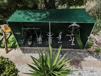 a drum set in a green box with a plant at Bella Terra Villa Filerimos in Rhodes Town