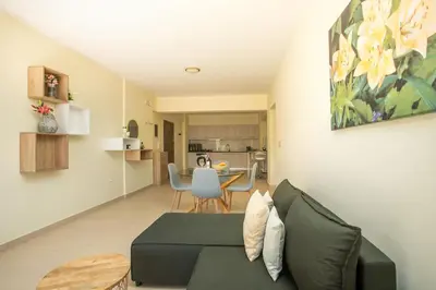 a living room with a couch and a table at Eden Lily- Luxurious Apartment with Sea View in Rhodes Town
