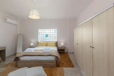 a bedroom with a large bed in a room at Bon Bonheur apartments in Rhodes Town