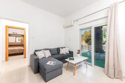 a living room with a couch and a table at Aleanna Cozy Luxury Apartments in Rhodes Town